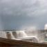 Waves crashing on breakwater in Alderney