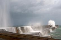 Waves crashing on breakwater in Alderney